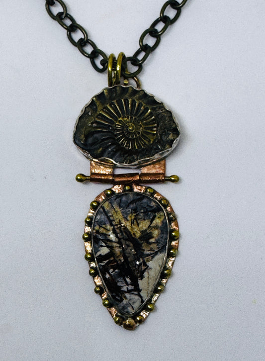 Ammonite Negative hinged to Astrophylite Necklace.